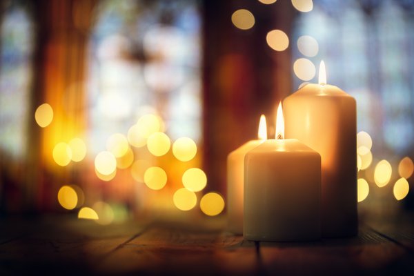 Lit candles in a church